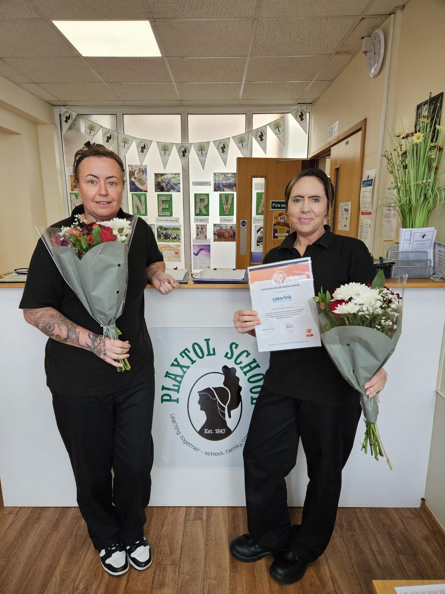 Jodie & Aimee receiving their certificate of excellence